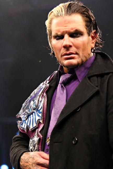 WWE-Jeff-Hardy-Holding-The-Belt-on-Shoulder.jpg